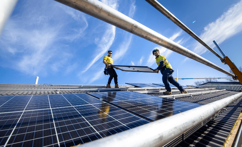 Solar workers installing solar panels
