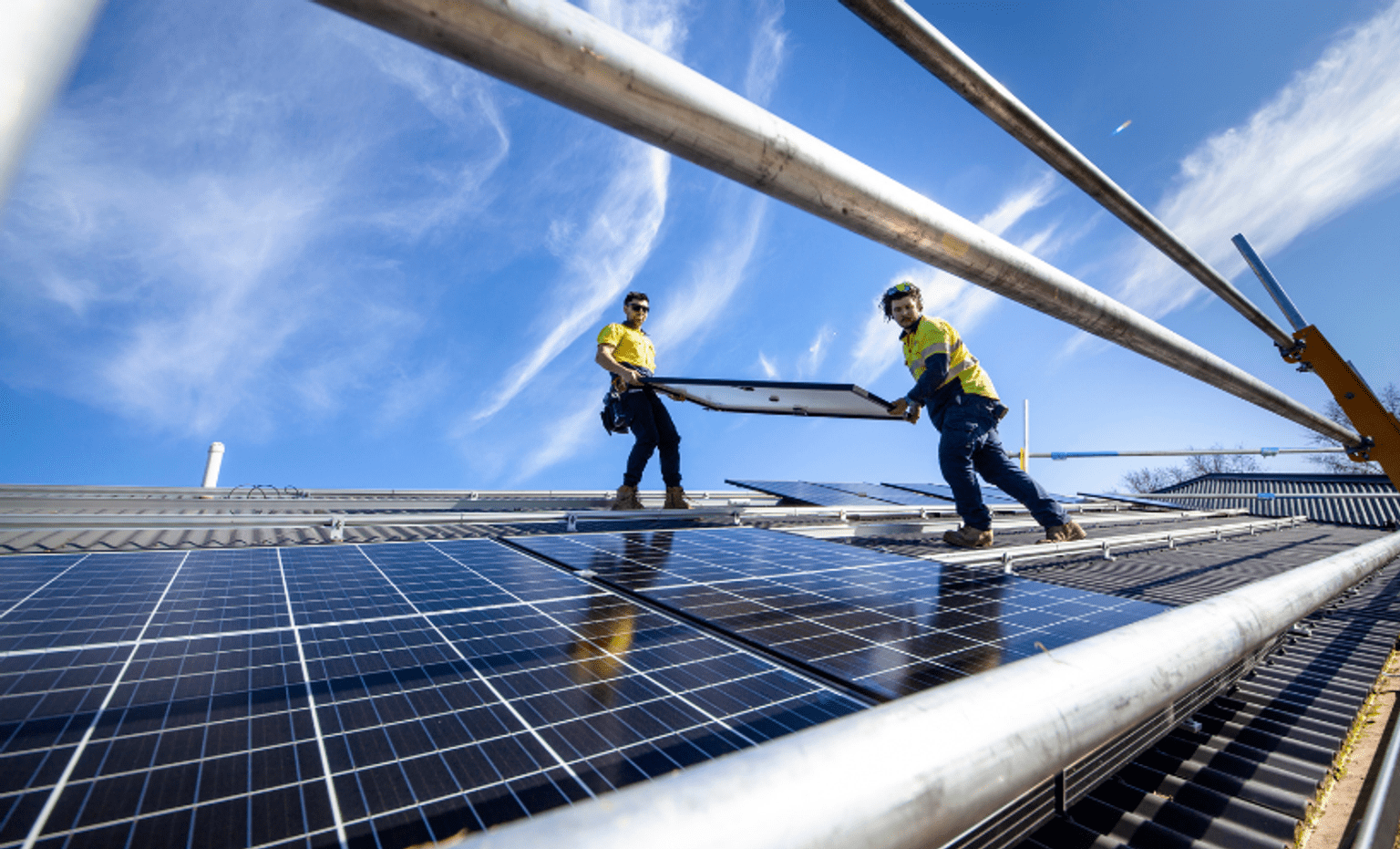 Solar workers installing solar panels
