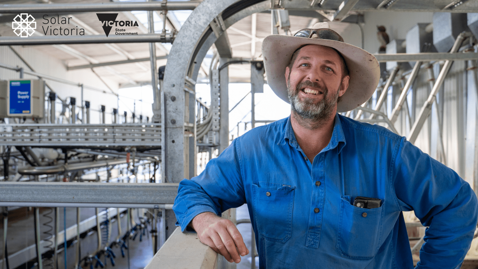 Farmer with hat smiling at camera