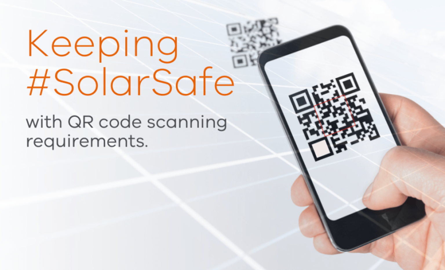 Hand holding a mobile phone with QR code on the screen